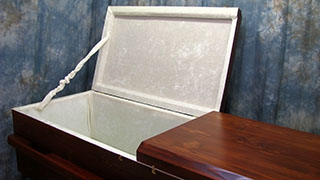 pine box casket (open lid)