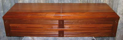 premier Mahogany wood casket w/center split lid.