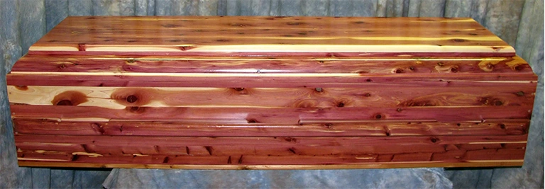 Tennessee Red Cedar Caskets - Tennessee Red Cedar is often referred to as Aromatic or Eastern red cedar. The fine-grained, soft brittle pinkish to brownish red heartwood is fragrant, very light and very durable, even in contact with soil. Because of its rot resistance, the wood is often used for caskets & coffins. Tennessee red cedar is an option for any of style of casket or coffin.