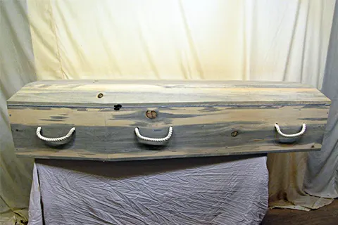 Cowboy Casket - Cowboy caskets fashioned in the old west style with a rugged yet attractive appeal.